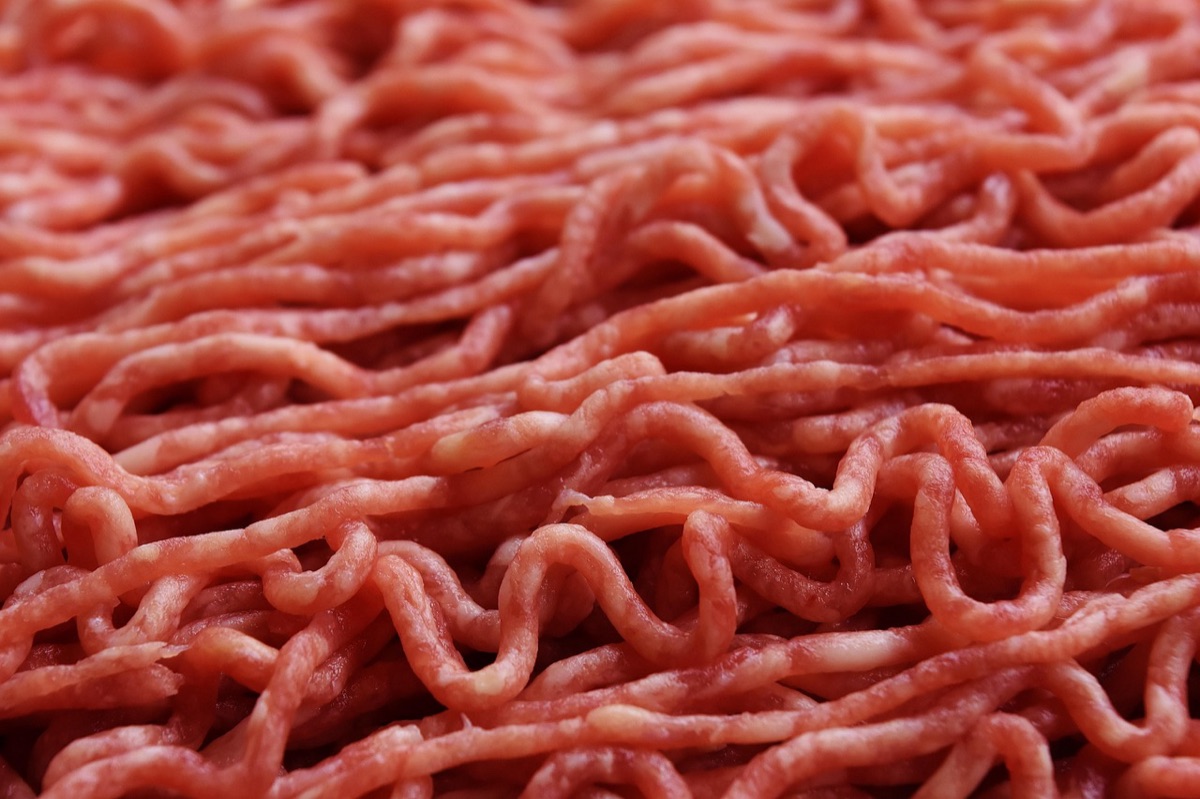 Close-up of raw poultry meat showing texture and surface details.