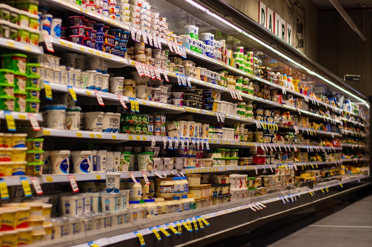Person in grocery aisle looking at fermented products